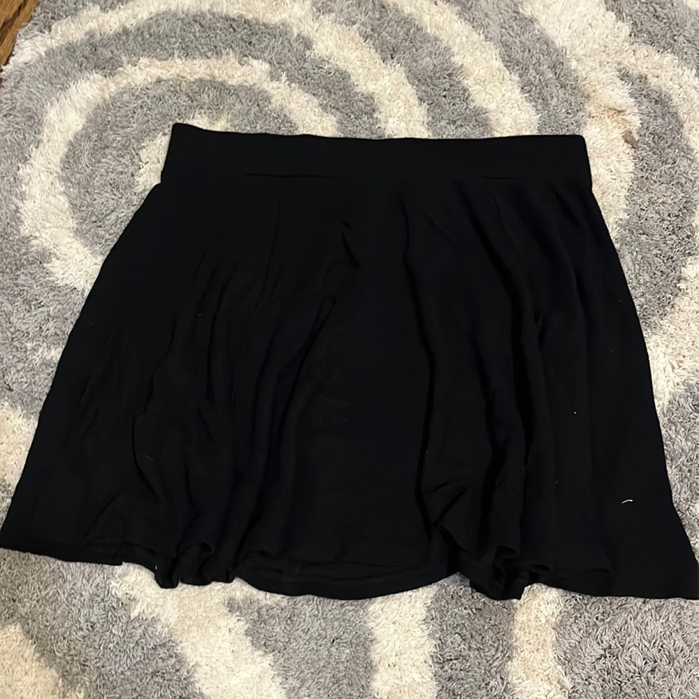H&M divided black flowy skirt. size M